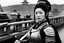 Placeholder: [on the bridge of the Potemkin] Onna bugeisha woman in armour with a katana on japanese battleship: Surreal... a psychological thriller... ... mix in a little World War II... sure... surreal events in an occupied town... man sees ancient soldier hiding in abandoned home... "Twilight Zone." What's that? No! You didn't want any jungle queens! Now wait a minute. You can't breathe. Too hot in here. Gotta open your eyes! Your mouth! What? They're open? Impossible-- You can't breathe! What? Fly? You a