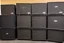 Placeholder: A wall of several concert speakers obe pied up