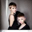 Placeholder: Russian short hair beautiful tomboy boyish boylike short man's haircut boyish features shortcut in black girlish nightgown in hotel wedding night