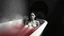 Placeholder: monochrome photo of very blur face sad pale woman sitting in bath tube around her red water, in bath, blur fog, background in corner one black demonic shadow, dark gray old wall, darkness around, sad, surreal dark vibe, dark colors, in wall circle dark deep abyss,splash art, cinematic, depressive vibe