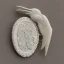 Placeholder: ivory brooch of a kingfisher, decorative design, classical ornament, highly ornate, highly intricate, highly detailed etching, marble carving, warm lighting, linen backdrop