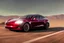 Placeholder: A Tesla 'Model S' is racing at top speed, in the Mojave Desert. (CINEMATIC, WIDE ANGLE LENS, PHOTO REAL)