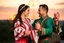 Placeholder: Young Azerbaijani couple performing traditional dance, joyful expressions, authentic costumes, dynamic movement, sunset lighting, cultural authenticity, photorealistic --ar 3:2 --style raw