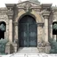 Placeholder: (art by underground comix artist, Charles Bukowski) The ornate gateway marks the boundary of a significant noble holding, though the weathered stonework and modest maintenance suggest a family of respectable but not exceptional wealth. The three-person security detail demonstrates the privatised nature of law enforcement beyond the capital's immediate environs – landed families maintain their own armed personnel for property protection, dispute resolution, and deterrence against banditry. These