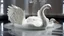 Placeholder: hyper realistic render of a swan carved out of white marble, sculpture is displayed inside of a big art exhibit