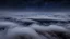 Placeholder: looking down from space at the mist and clouds, surrounded by the mist at night starry sky. majority of the image is space