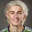 Placeholder: 85mm DSLR color photography of a very detailed headshot fitting all of head and hair in frame. 18-year-old English soccer player, and with no facial hair and has no facial hair, has short length straight white hair with a small smile, grey background