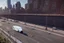 Placeholder: A Tesla 'Semi' (semi truck) is parked, on the 'FDR Drive', eastern Manhattan. (CINEMATIC, WIDE ANGLE LENS, PHOTO REAL)