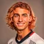 Placeholder: 85mm DSLR color photography of a very detailed headshot fitting all of head and hair in frame. 18-year-old Italian soccer player, with rose gold hair color and no facial hair and has very short hair and with a small smile, grey background