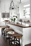 Placeholder: cocina blanca con bancada en madera y campana decorativa. añade una barra y 4 taburetes