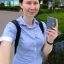 Placeholder: A short haired, female computer engineer taking a selfie in front of Building 92 at Microsoft