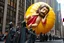 Placeholder: macys thanksgiving day parade style cartoonish giant baby jesus floating parade balloon pulled by multiple grim reapers, multi colored, bright, vivid, psychedelic, high detailed, high gloss, insanely detailed, matte, horrorcore, lining the street, unsettling contrast, monument to death, live action shot grim reaper parade, pulling a jesus parade float