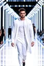 Placeholder: A guy on a fashion runway with Kryptonian design clothes white tones