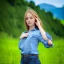 Placeholder: gorgeous young Swiss girl sitting standing in green field, mountain, sun, wearing blue shirt over, open arms, unreal engine, photograph, realistic skin texture, photorealistic, hyper realism, highly detailed, 85mm portrait photography