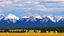 Placeholder: rocky mountains behind the Alberta prairie