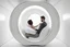 Placeholder: realistic photograph futuristic pod, ceramic aluminum orb pod with window. white walls and hands.