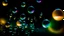 Placeholder: Lots of pale rainbow-colored transparent soap bubbles floating in the dark.