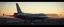 Placeholder: airbrush 3d rendering, Prompt: A cinematic, photorealistic sci-fi aircraft on a runway at dusk, viewed from the rear three-quarter angle. The aircraft has a large vertical tail fin and a weathered metallic fuselage with realistic rivets, panel seams, hydraulics, vents and mechanical details. Mounted across the aircraft's rear section is a long transparent cylindrical lightning tube positioned horizontally from left to right, completely perpendicular to the aircraft's longitudinal body axis.