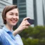 Placeholder: A short haired, female computer engineer taking a selfie in front of Building 92 at Microsoft