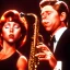 Placeholder: eyes closed REd-haired ron howard as richie from happy days Is playing the saxophone with his "eyes closed", rock band, saxophone lips, looking at camera