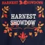 Placeholder: an autumn colored textured cloth embroidered ornamental leaves and cattle, pointed bottom, on dark background, embroidered text across top "HARVEST SHOWDOWN" block text, Canadian western cowboy style