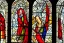 Placeholder: Cloaked woman holding fire on stain glass window