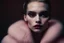 Placeholder: Minimalistic portrait of a beautiful woman with red lips and cold big eyes wearing earrings, a light pink fur coat in a haute couture style isolated on a dark background, cinematic lighting, ultra-realistic, shot in the style of hasselblad x2d + pishington e skinner + peter coulson, minimalism --ar 5164