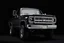 Placeholder: front corner 1973 Chevrolet square body truck(lifted) facing a little to viewer's left, dark gray background, high contrast black and white vector