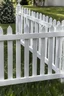 Placeholder: white vinyl fence in yard, photograph