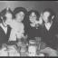 Placeholder: Creepy old photo of new years eve party with monster cat