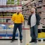 Placeholder: Walter White yells at Jessie Pinkman in a Costco, photorealistic