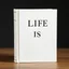 Placeholder: Un livre classique blanc ntitulé Life is.