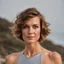 Placeholder: beautiful woman, standing frontal, short silver triathlon swimsuit, wavy bob haircut, photographed in front of beach, raw