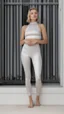 Placeholder: satin leggins, lycra leggins, satin top, lycra top, replace background with palmtrees, beach, sunlight, short wavy bob haircut, satin leggins, satin top