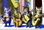 Placeholder: Group of three mature cats musicians, one cat playing guitar, one cat playing drums, one cat holding microphone and singing, street, Vienna, smiling, sunny day, model style, hyper realistic, extremely accurate, delicate, extremely detailed, Graphic novel style, wide-angle, open aperture, superfine pencil