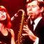 Placeholder: REd-haired Ron howard Is richie from happy days playing the saxophone with his "eyes closed", rock band, embouchure, joanie cunningham