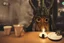 Placeholder: cute coffeshop creature H. R. Giger in candlelight