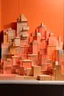 Placeholder: A light rosy orange colored town made out of stacked blocks painted by Raymond Duchamp-Villon