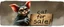 Placeholder: air brush 3d with pen outline, mongrel goblin gremlin looking at sign with big cute cat monster saying "cat for sale" with blurred shadow outline, charcoal fog border
