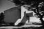 Placeholder: Minimalist concrete structure with geometric forms and dramatic shadows, near the ocean in seaside Oregon, inspired by awe, Brutalist style, Le Corbusier, photographed by Ezra Stoller