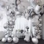 Placeholder: A picture of a room filled with silver party decoration. Include balloons, garlands, foil balloons