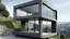 Placeholder: Un prisma rectangular de estuco gris oscuro con un gran vacío estructurado en la planta baja que permite ver el paisaje posterior, contrastando con un cubo de vidrio claro que emerge en voladizo en la esquina superior mostrando un mobiliario escueto.