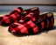 Placeholder: Red plaid slipper on a fur rug