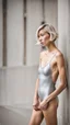 Placeholder: beautiful asian anorexic woman, total shot, short silver triathlon swimsuit, short blond wavy bob hair, blurred concrete background