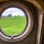 Placeholder: round window looking out onto hobbiton