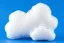 Placeholder: white plushie stuffed toy clouds with blue yarn stitching around edge, blue background