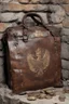 Placeholder: in the BASEMENT there is an old, broken brown oblong leather chest with short handles, from which gold coins from the time of Catherine the Great fall out. The ancient coat of arms of tsarist Russia, the double-headed eagle, is BARELY VISIBLE on the bag. There are a lot of broken bricks and earth around the bag. All in high quality 8K