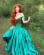 Placeholder: Magic princess with long auburn hair in a big teal green and gold satin ballgown corset off shoulder top casting magic