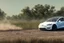 Placeholder: A Tesla 'Model S' is drifting at high speeds, at the Wetlands of Louisiana. (CINEMATIC, WIDE ANGLE LENS, PHOTO REAL)