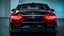 Placeholder: Full image of the rear view of a black Mercedes-Benz CLS with lights on
